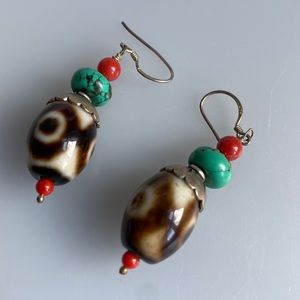 Three eyelet dzi with turquoise and coral silver earrings.